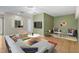 Beautifully decorated living room with modern furnishings, bright colorful rugs, and unique wall art at 1050 Starkey Rd # 704, Largo, FL 33771
