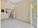 Open living room with light wood floors and high ceilings, creating a spacious atmosphere at 1050 Starkey Rd # 704, Largo, FL 33771