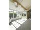 Bright sunroom with large windows, tile flooring, and plenty of natural light from the surrounding outdoor foliage at 1050 Starkey Rd # 704, Largo, FL 33771