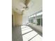 An airy sunroom featuring tile floors, large windows, and dual ceiling fans for a comfortable, bright space at 1050 Starkey Rd # 704, Largo, FL 33771
