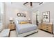 Bright bedroom with a walk-in closet and windows for natural lighting, with a neutral color palette and modern decor at 10520 Boardwalk Loop # 202, Bradenton, FL 34202