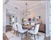 Elegant dining room with modern chandelier, and stylish decor, creating a perfect setting for entertaining guests at 10520 Boardwalk Loop # 202, Bradenton, FL 34202