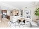 Bright living room showcasing open-concept design, stylish furnishings, and natural light, perfect for relaxation at 10520 Boardwalk Loop # 202, Bradenton, FL 34202