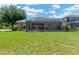 Well-kept backyard and screened in patio providing a serene outdoor living space at 11153 Biddeford Pl, New Port Richey, FL 34654