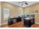 Home office featuring dark wood desks, hardwood floors and natural light at 11153 Biddeford Pl, New Port Richey, FL 34654