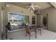 Relaxing covered patio with table and chairs overlooking a sparkling pool and backyard at 11153 Biddeford Pl, New Port Richey, FL 34654