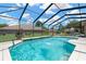 Enjoy the refreshing screened pool with a lovely water feature and spacious deck for lounging at 11153 Biddeford Pl, New Port Richey, FL 34654
