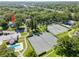 Birds eye view of the community highlighting its tennis courts, swimming pool, mature trees, and proximity to the highway at 11799 Raintree Dr, Temple Terrace, FL 33617