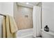 Charming bathroom with a shower/tub combo and a tiled wall niche for storage at 11799 Raintree Dr, Temple Terrace, FL 33617
