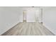 Spacious bedroom with laminate flooring, en-suite bathroom, and closet at 11799 Raintree Dr, Temple Terrace, FL 33617