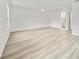 Bright, spacious bedroom with light gray floors, a ceiling fan, and lots of natural light at 11799 Raintree Dr, Temple Terrace, FL 33617