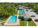 Community pools, a clubhouse, lounge chairs and ample parking in this inviting neighborhood at 11799 Raintree Dr, Temple Terrace, FL 33617