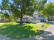 Charming townhouse with well-manicured lawn and mature trees offering shade at 11799 Raintree Dr, Temple Terrace, FL 33617
