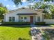 Charming single-story home featuring a well-maintained lawn and inviting curb appeal at 11799 Raintree Dr, Temple Terrace, FL 33617