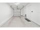 Spacious, clean garage with white walls, concrete floor, and garage door at 11799 Raintree Dr, Temple Terrace, FL 33617