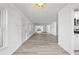 Spacious living area featuring new flooring, ample lighting, and open space at 11799 Raintree Dr, Temple Terrace, FL 33617