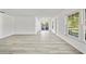 Bright, airy living area with hardwood floors, slider door, and natural light at 11799 Raintree Dr, Temple Terrace, FL 33617