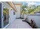 Tiled back patio offers a private outdoor space, perfect for relaxing and entertaining at 11799 Raintree Dr, Temple Terrace, FL 33617