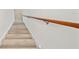 Close up of the staircase featuring wood railing and laminate steps at 11799 Raintree Dr, Temple Terrace, FL 33617