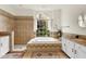 Luxurious bathroom featuring a soaking tub, shower, and granite countertops at 12031 Mountbatten Dr, Tampa, FL 33626