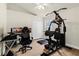 Bedroom features a home gym, desk setup, and double door closet at 12031 Mountbatten Dr, Tampa, FL 33626