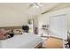 Bright bedroom with a ceiling fan, large closet and an angled ceiling at 12031 Mountbatten Dr, Tampa, FL 33626
