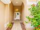 Inviting front entrance with arched doorway, tiled walkway, and a 'Welcome' sign at 12031 Mountbatten Dr, Tampa, FL 33626