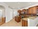 Open kitchen with center island, stainless appliances, and wooden cabinets at 12031 Mountbatten Dr, Tampa, FL 33626