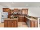This kitchen is equipped with stainless steel appliances and wooden cabinets at 12031 Mountbatten Dr, Tampa, FL 33626