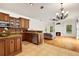 Updated kitchen features granite counters, stainless appliances and view into the living room with fireplace at 12031 Mountbatten Dr, Tampa, FL 33626