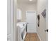 Laundry room with side-by-side washer and dryer on a neutral tiled floor at 12031 Mountbatten Dr, Tampa, FL 33626