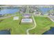 An aerial shot of the community pool featuring a volleyball court and walking path to the pool area at 13194 Royal Pines Ave, Riverview, FL 33579