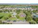 Aerial view of neighborhood with playground, gazebo, pool, and lake views at 13194 Royal Pines Ave, Riverview, FL 33579