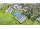 Aerial shot featuring a tennis court, basketball court, community pool and a clubhouse at 13194 Royal Pines Ave, Riverview, FL 33579