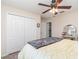 Comfortable bedroom features a large closet, ceiling fan, and view to the en suite bathroom at 13194 Royal Pines Ave, Riverview, FL 33579