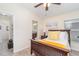 Bright bedroom includes an en suite bathroom and an abundance of natural light at 13194 Royal Pines Ave, Riverview, FL 33579