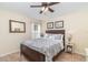 Cozy bedroom features ceiling fan and tiled flooring at 13194 Royal Pines Ave, Riverview, FL 33579