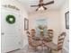 Cozy dining area featuring a round glass table with decorative chairs, complemented by neutral walls at 13194 Royal Pines Ave, Riverview, FL 33579