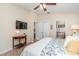 Relaxing main bedroom featuring ceiling fan and access to ensuite bathroom and closet at 13194 Royal Pines Ave, Riverview, FL 33579