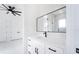 Bathroom features a modern black faucet and a large mirror above the vanity at 14080 Sydney Rd, Dover, FL 33527