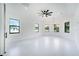Spacious bedroom features tray ceilings, lots of natural light, and views to the outside at 14080 Sydney Rd, Dover, FL 33527