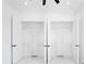 Open closet features custom shelving, hanging racks, and all-white decor at 14080 Sydney Rd, Dover, FL 33527