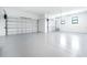 A two car garage with an epoxy floor at 14080 Sydney Rd, Dover, FL 33527