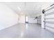 A spacious two car garage with an epoxy floor at 14080 Sydney Rd, Dover, FL 33527