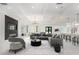Stylishly furnished living room with modern decor, an eye-catching chandelier, and luxurious seating at 14080 Sydney Rd, Dover, FL 33527