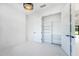 Empty office with walk-in closet, luxury chandelier, and a view to the outside at 14080 Sydney Rd, Dover, FL 33527