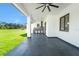 Covered patio with an outdoor kitchen and an expansive view of the backyard at 14080 Sydney Rd, Dover, FL 33527