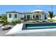 Stunning pool area with modern lounge seating, an outdoor patio, and fire pit at 14080 Sydney Rd, Dover, FL 33527
