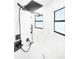 Modern walk-in shower with marble-look tile and black fixtures at 14080 Sydney Rd, Dover, FL 33527