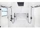 Spa-like walk-in shower with dual shower heads and a niche for storage at 14080 Sydney Rd, Dover, FL 33527